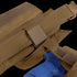 Close-up of the Condor Slim Battle Belt in brown nylon, securely holding a blue plastic training handgun—perfect for military training or first responder drills.